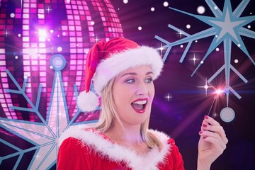 Poster - Composite image of festive blonde smiling at hand