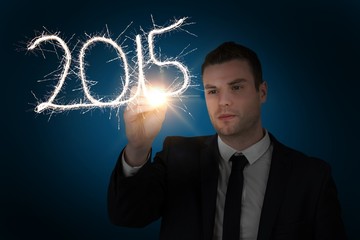 Poster - Composite image of businessman touching spark