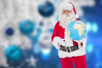 Poster - Composite image of happy santa claus holding a globe