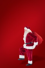 Aufkleber - Composite image of santa jumps with his bag