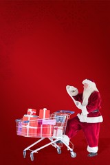 Aufkleber - Composite image of santa pushes a shopping cart while reading