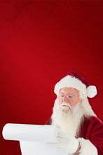 Composite Image Of Santa Claus Checking His List