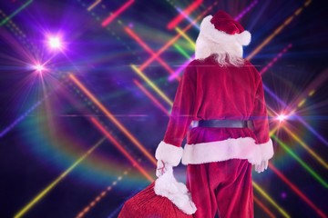 Aufkleber - Composite image of santa carrying sack of gifts