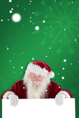 Aufkleber - Composite image of santa holds a sign and looks down