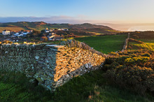 Stone Wall And Coastal View Near Mortehoe In North Devon, Englan