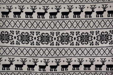 knitted pattern with deer and snowflakes