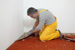 © sima - Home renovation, worker remove carpet from room floor