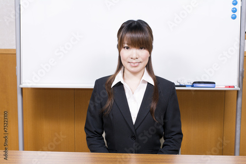 ホワイトボードの前で座るスーツ姿の女性 Buy This Stock Photo And Explore Similar Images At Adobe Stock Adobe Stock