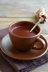 Wall Mural - Sweet chocolate in a cup on napkin