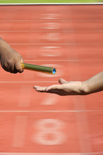  Relay-athletes Hands Sending Action On Blur Race Track  Startin