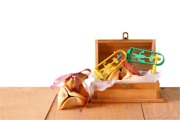 hamantaschen cookies or hamans ears and noisemaker for purim cel