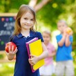 © MNStudio - Excited little schoolgirl going back to school