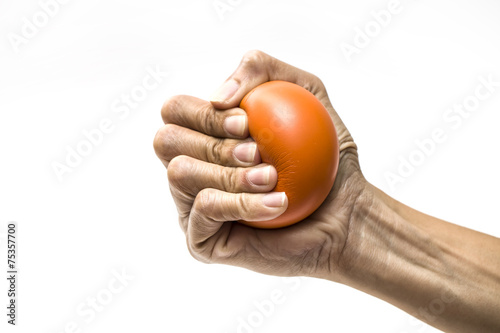 Fotografija  Hands of a woman squeezing a stress ball