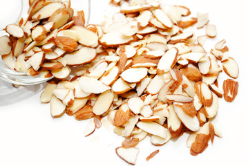 slivered almonds spilled out of a glass bowl