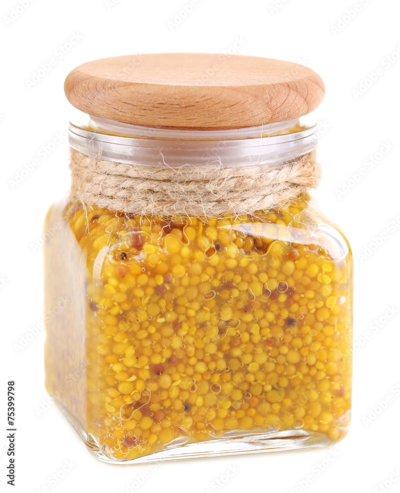 Dijon Mustard in glass jar isolated on white