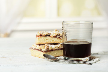 Canvas Print - Glass of espresso and tasty homemade pie on wooden table