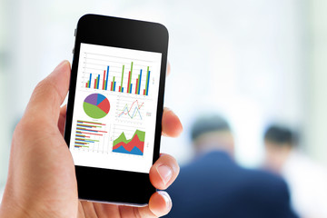 Poster - hand holding mobile phone with analyzing graph