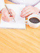 © M.Photos - Hands writing with coffee, planning concept
