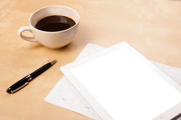 Wall Mural - tablet pc with empty space and a cup of coffee on a desk