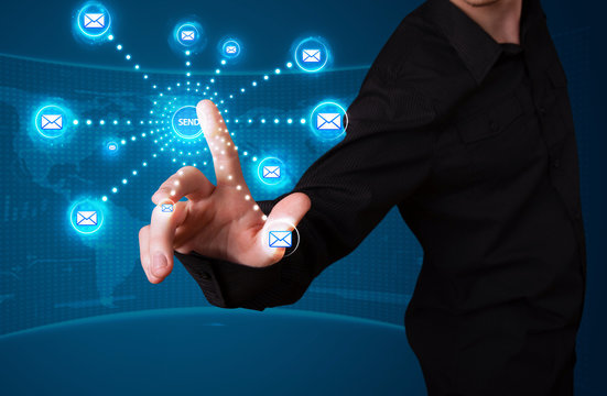 Businessman pressing virtual messaging type of icons
