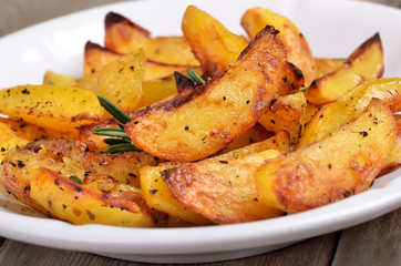 Wall Mural - Fried potato wedges on white plate