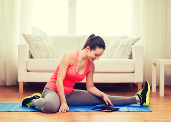 Poster - smiling teenage girl streching on floor at home