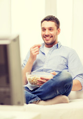 Sticker - smiling man watching sports at home