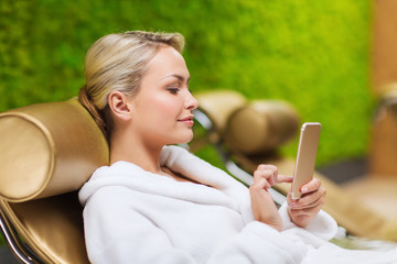 Sticker - beautiful young woman with smartphone at spa