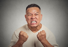 Headshot Angry Man With Open Mouth Fist Up In Air Screaming