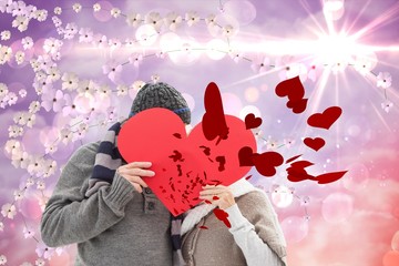 Aufkleber - Happy mature couple in winter clothes holding red heart