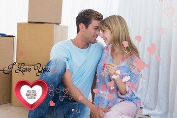 Poster - Couple holding new house key against cardboar