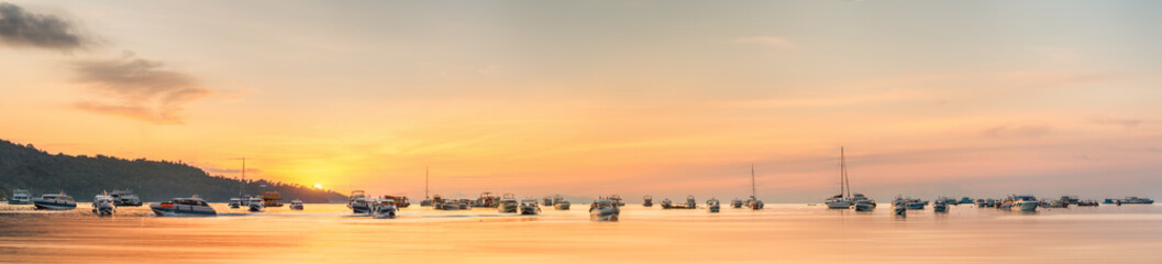 Wall Mural - sunset with colorful sky and boat on the beach