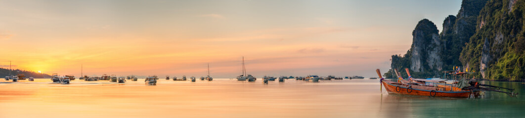 Wall Mural - sunset with colorful sky and boat on the beach