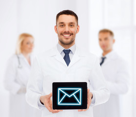 Poster - smiling male doctor with tablet pc