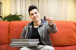 © theartofphoto - Young man showing difference between USB drive and heavy books
