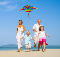 Canvas Print - Family running on the beach