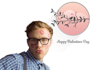 Poster - Composite image of geeky hipster covered in kisses