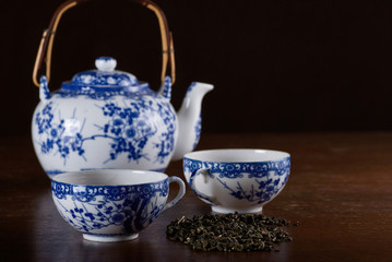 Wall Mural - Old Chinese porcelain teapot with two cups