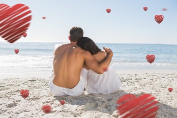 Aufkleber - Composite image of couple sitting on the sand watching the sea