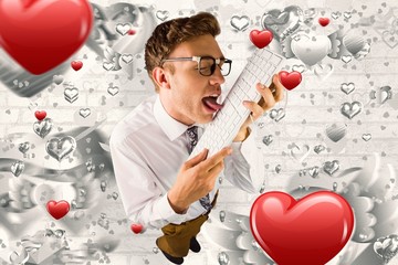 Poster - Composite image of geeky businessman licking his keyboard
