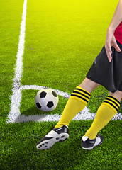 Wall Mural - Soccer player in a corner kick