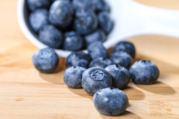 Blueberry  on a spoon concept for healthy eating and nutrition s