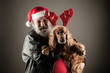 Santa Claus  with his dog  as Rudolph