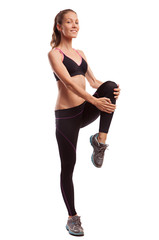 Wall Mural - Young beautiful fitness girl doing streching exercise. isolated 