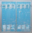 © artesiawells - Blue old industrial metal door with ventilation and flaky paint
