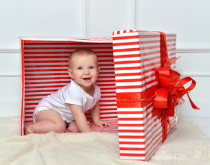 infant child baby toddler kid sitting in presents gift