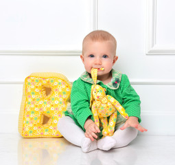 Infant child baby toddler sitting happy smiling and eating soft