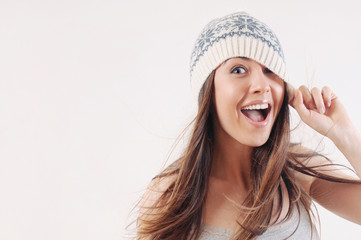 happy emotional woman in winter knitted hat