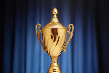 Wall Mural - gold cup on a dark blue background