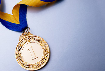 Wall Mural - gold medal on a blue background